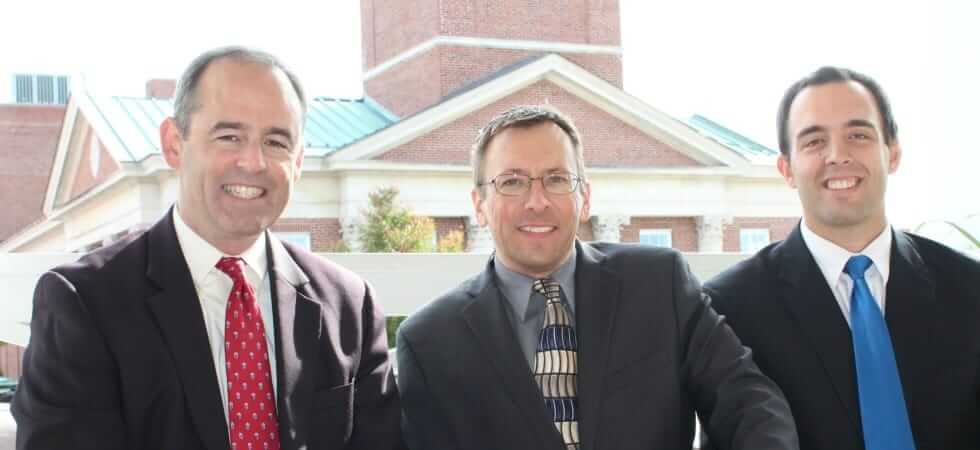 Photo of attorneys Dearie, Fischer and Mathews